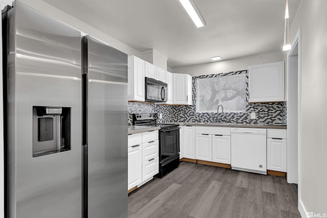4 Smithridge, Reno, NV 89502 - kitchen with black appliances, tasteful backsplash, light wood finished floors, a sink, and white cabinets