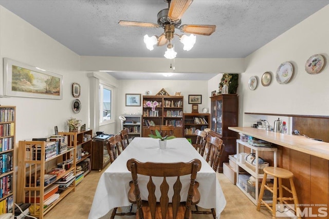 3230 Downey Ave, Reno, NV 89503 - dining room featuring ceiling fan and a textured ceiling