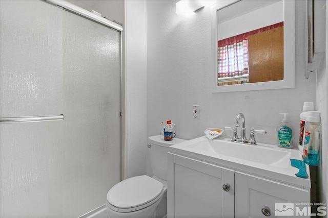 3230 Downey Ave, Reno, NV 89503 - bathroom with a shower stall, toilet, and vanity