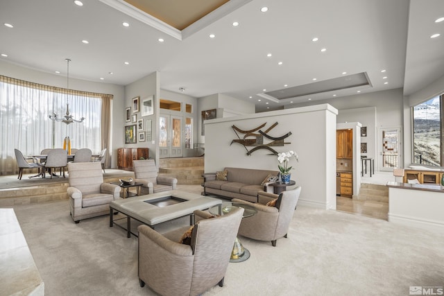 3605 Silver Vista Dr, Reno, NV 89511 - living area with a tray ceiling, recessed lighting, a chandelier, light colored carpet, and baseboards