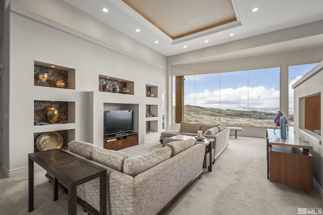 3605 Silver Vista Dr, Reno, NV 89511 - living area featuring recessed lighting, light carpet, built in features, a tray ceiling, and baseboards