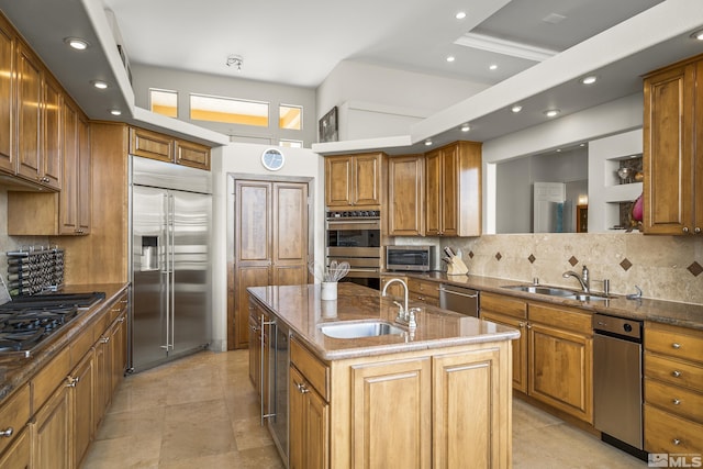 3605 Silver Vista Dr, Reno, NV 89511 - kitchen featuring stainless steel appliances, a sink, a center island with sink, recessed lighting, and tasteful backsplash