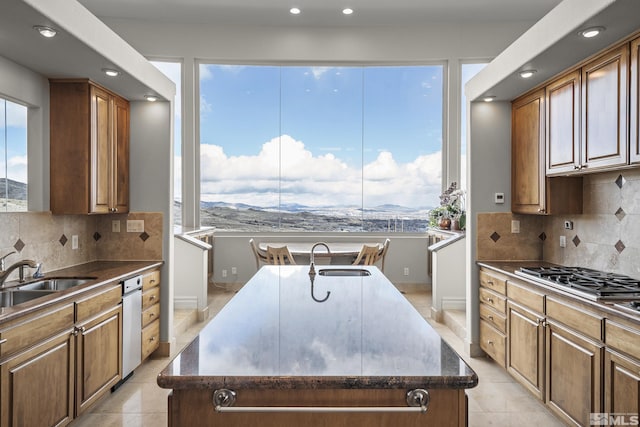 3605 Silver Vista Dr, Reno, NV 89511 - kitchen with a sink, a kitchen island with sink, plenty of natural light, and recessed lighting