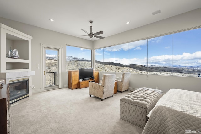 3605 Silver Vista Dr, Reno, NV 89511 - bedroom featuring access to exterior, carpet flooring, recessed lighting, a glass covered fireplace, and ceiling fan