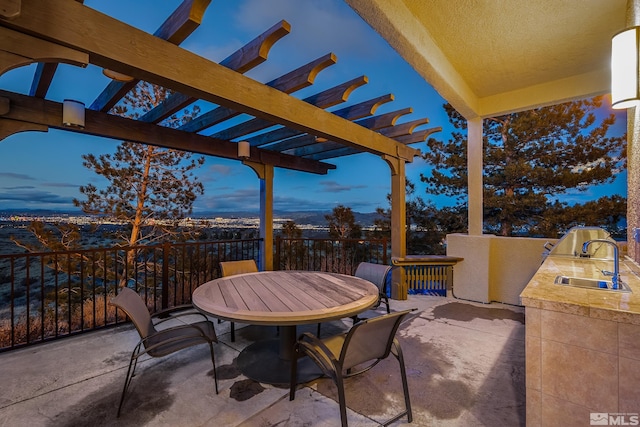 3605 Silver Vista Dr, Reno, NV 89511 - patio terrace at dusk with a sink, a pergola, area for grilling, and outdoor dining space