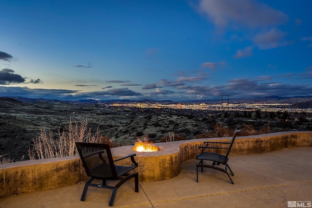 3605 Silver Vista Dr, Reno, NV 89511 - view of patio / terrace with an outdoor fire pit and a mountain view