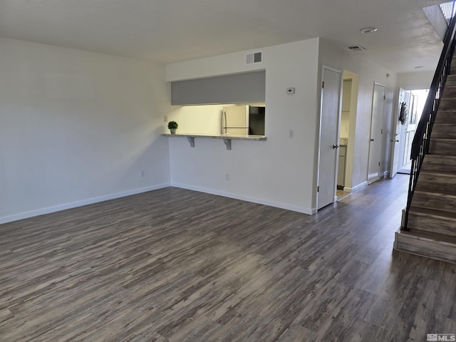 1023 Adrian Way, Sparks, NV 89431 - spare room featuring dark wood finished floors, baseboards, and stairs