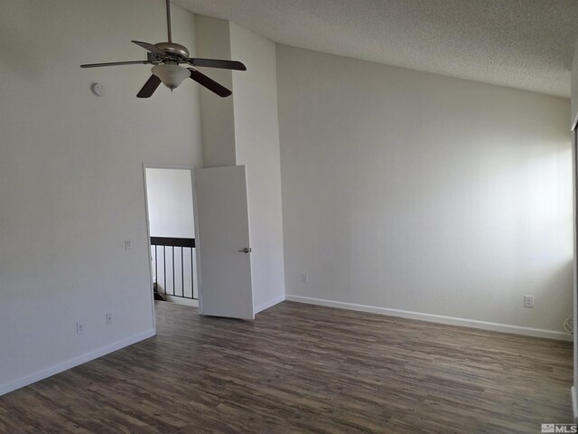 1023 Adrian Way, Sparks, NV 89431 - unfurnished room featuring dark wood finished floors, a ceiling fan, vaulted ceiling, baseboards, and a textured ceiling