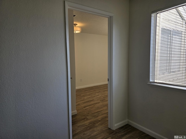 1023 Adrian Way, Sparks, NV 89431 - hallway with dark wood-style flooring, baseboards, and plenty of natural light