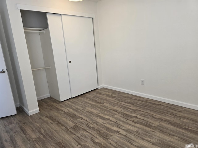 1023 Adrian Way, Sparks, NV 89431 - unfurnished bedroom featuring dark wood-style floors, a closet, and baseboards