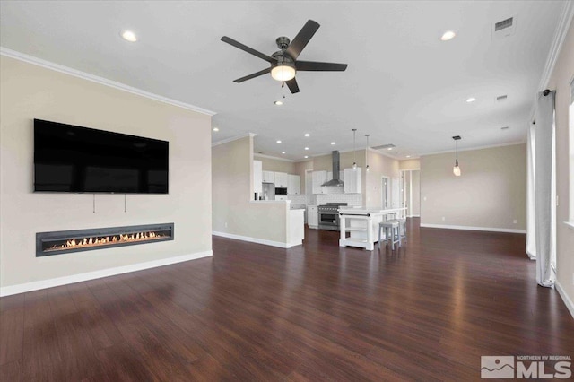 6141 Solstice Dr, Sparks, NV 89436 - unfurnished living room with ornamental molding, ceiling fan, dark wood-type flooring, recessed lighting, and baseboards