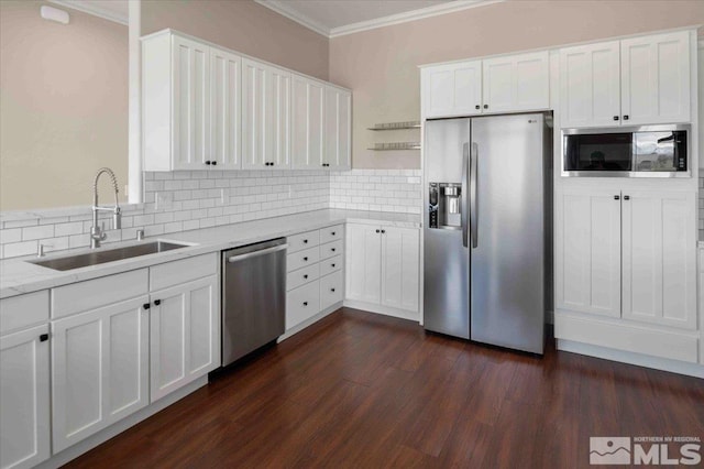 6141 Solstice Dr, Sparks, NV 89436 - kitchen with stainless steel appliances, crown molding, a sink, open shelves, and white cabinets