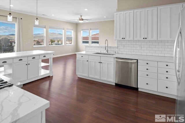 6141 Solstice Dr, Sparks, NV 89436 - kitchen featuring a sink, stainless steel appliances, dark wood-type flooring, ornamental molding, and decorative backsplash