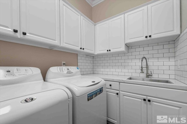 6141 Solstice Dr, Sparks, NV 89436 - washroom with cabinet space, washer and clothes dryer, and ornamental molding