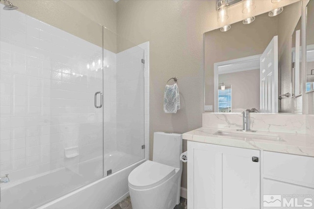 6141 Solstice Dr, Sparks, NV 89436 - bathroom with combined bath / shower with glass door, toilet, and vanity