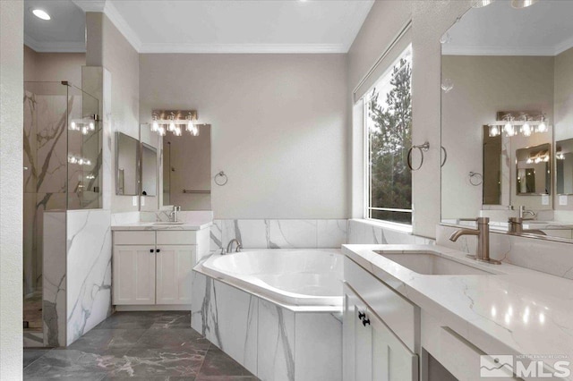 6141 Solstice Dr, Sparks, NV 89436 - full bath with a marble finish shower, marble look tiles, a bath, ornamental molding, and two vanities