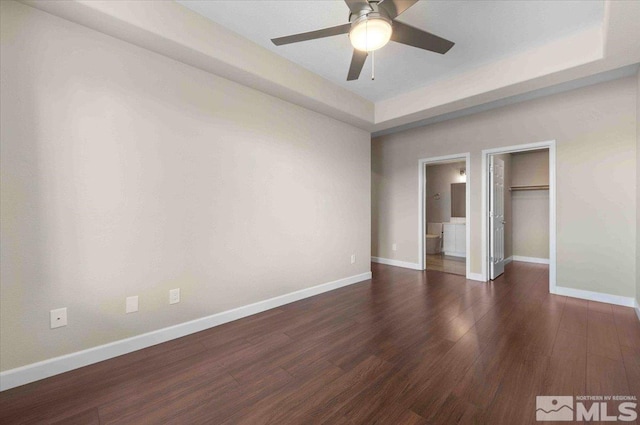 6141 Solstice Dr, Sparks, NV 89436 - unfurnished bedroom featuring baseboards, wood finished floors, a walk in closet, and a closet