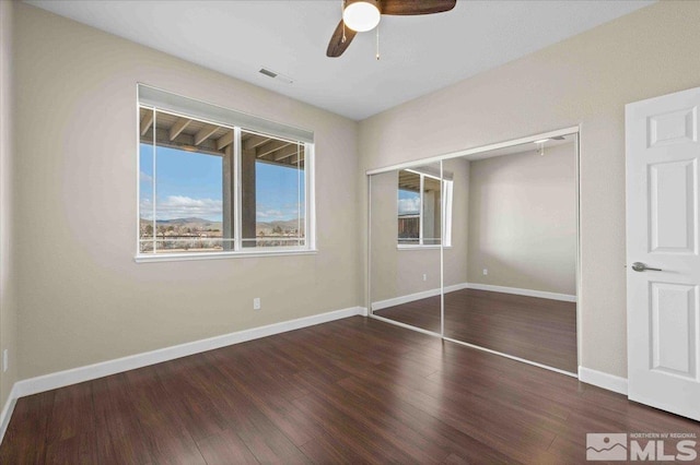 6141 Solstice Dr, Sparks, NV 89436 - unfurnished bedroom featuring a closet, wood finished floors, baseboards, and ceiling fan