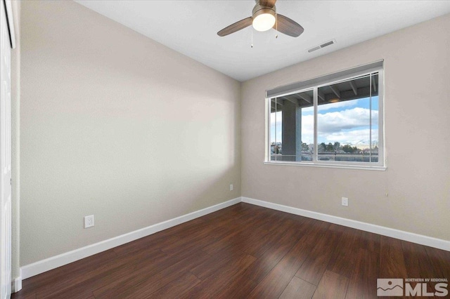 6141 Solstice Dr, Sparks, NV 89436 - empty room featuring dark wood-type flooring, ceiling fan, and baseboards