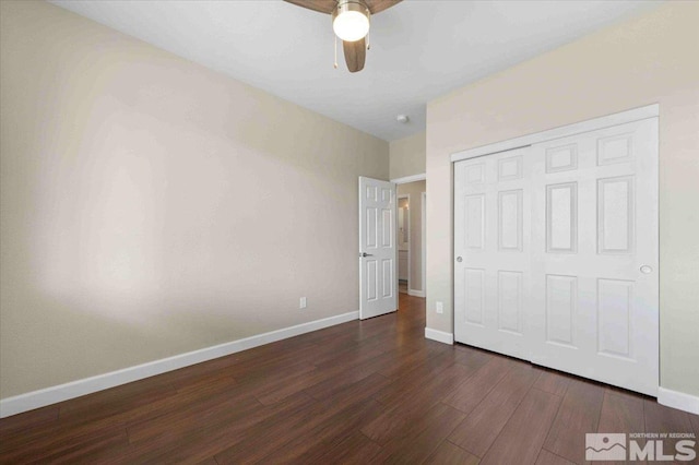 6141 Solstice Dr, Sparks, NV 89436 - unfurnished bedroom featuring dark wood-style flooring, a closet, baseboards, and ceiling fan