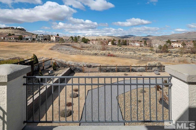 6141 Solstice Dr, Sparks, NV 89436 - fenced backyard with a mountain view and a gate