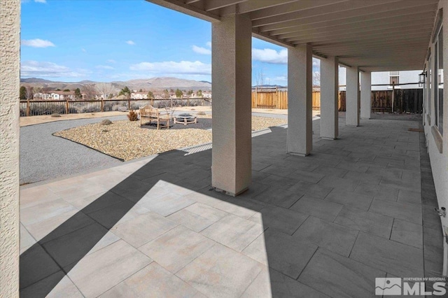 6141 Solstice Dr, Sparks, NV 89436 - view of patio / terrace with a mountain view and a fenced backyard