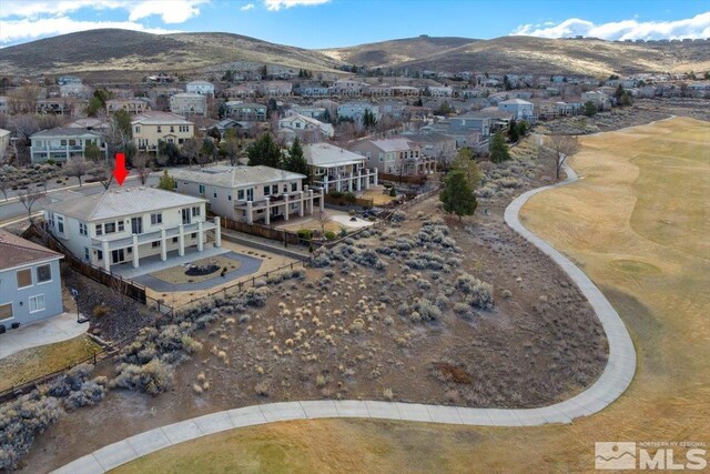 6141 Solstice Dr, Sparks, NV 89436 - aerial perspective of suburban area with a mountain backdrop