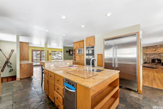626 Canyon Dr, Zephyr Cove, NV 89448 - kitchen featuring stainless steel appliances, a sink, stone tile flooring, a spacious island, and recessed lighting