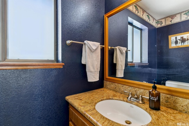 626 Canyon Dr, Zephyr Cove, NV 89448 - bathroom with vanity, toilet, and a textured wall