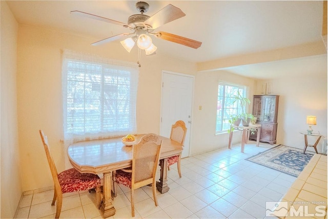 1845 Auburn Way, Reno, NV 89502 - dining area with ceiling fan and light tile patterned flooring