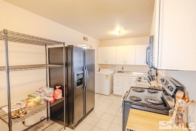1845 Auburn Way, Reno, NV 89502 - kitchen featuring washer / clothes dryer, stainless steel electric stove, white cabinetry, light countertops, and light tile patterned floors