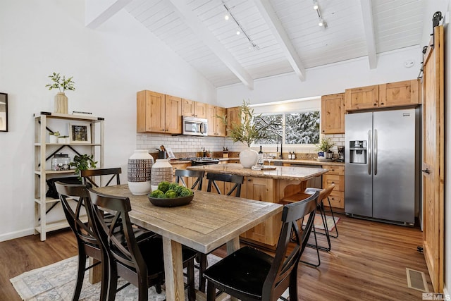 321 Ski Way Unit 29, Incline Village, NV 89451 - dining space with track lighting, wood finished floors, beamed ceiling, wooden ceiling, and baseboards