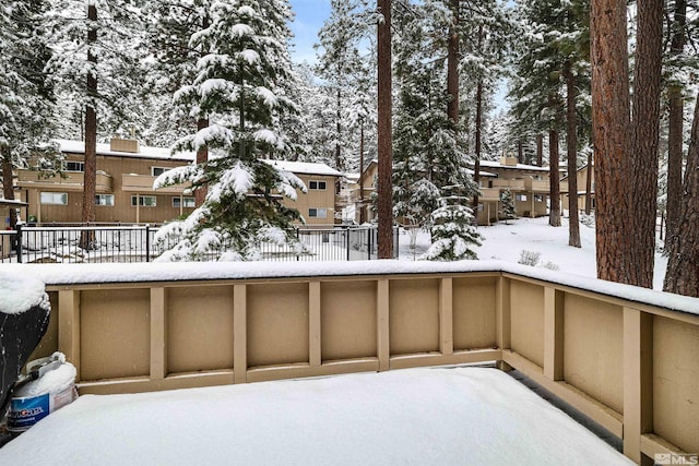 321 Ski Way Unit 29, Incline Village, NV 89451 - snow covered patio with a balcony, fence, and a residential view