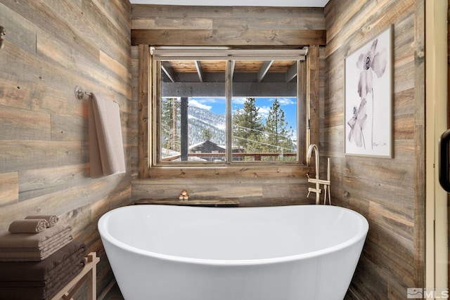 520 Laurel Ln, Stateline, NV 89449 - bathroom featuring wood walls and a freestanding tub