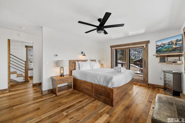 520 Laurel Ln, Stateline, NV 89449 - bedroom featuring access to exterior, hardwood / wood-style flooring, baseboards, and a ceiling fan
