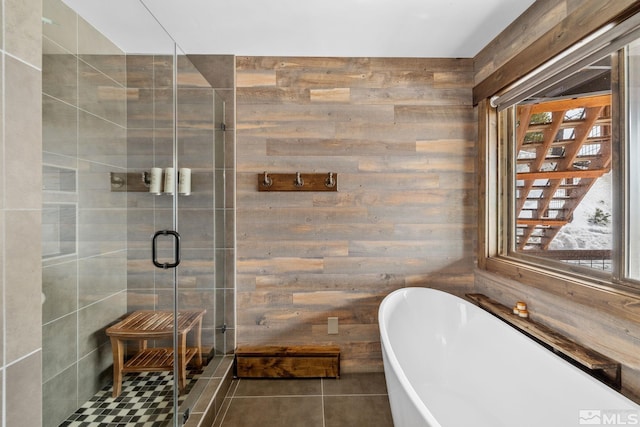 520 Laurel Ln, Stateline, NV 89449 - full bath with a shower stall, wooden walls, a freestanding tub, and tile patterned floors
