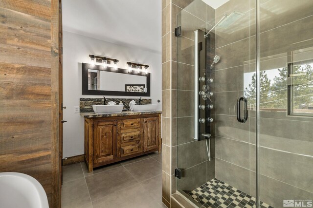 520 Laurel Ln, Stateline, NV 89449 - bathroom featuring a shower stall, tile patterned floors, and double vanity