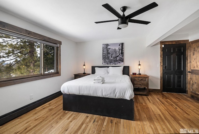 520 Laurel Ln, Stateline, NV 89449 - bedroom with baseboards, hardwood / wood-style flooring, and a ceiling fan