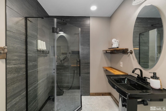 520 Laurel Ln, Stateline, NV 89449 - bathroom featuring a tile shower, recessed lighting, and a sink