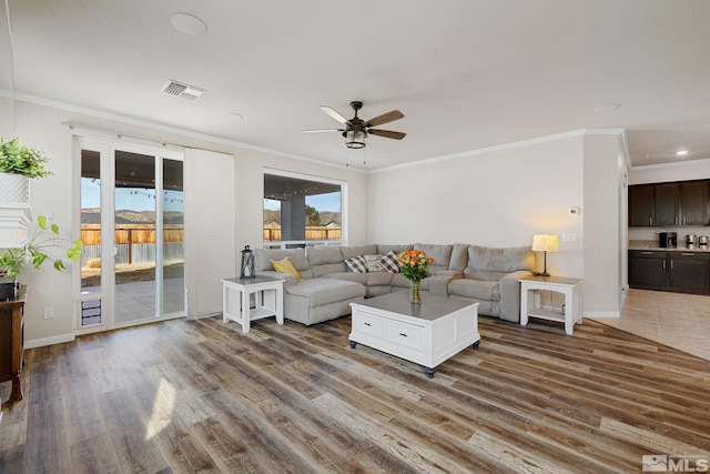 2183 Kingston Canyon Dr, Sparks, NV 89441 - living area featuring wood finished floors, a ceiling fan, ornamental molding, baseboards, and recessed lighting
