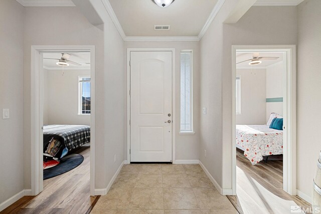 2183 Kingston Canyon Dr, Sparks, NV 89441 - entrance foyer featuring crown molding, ceiling fan, baseboards, and light wood-style floors