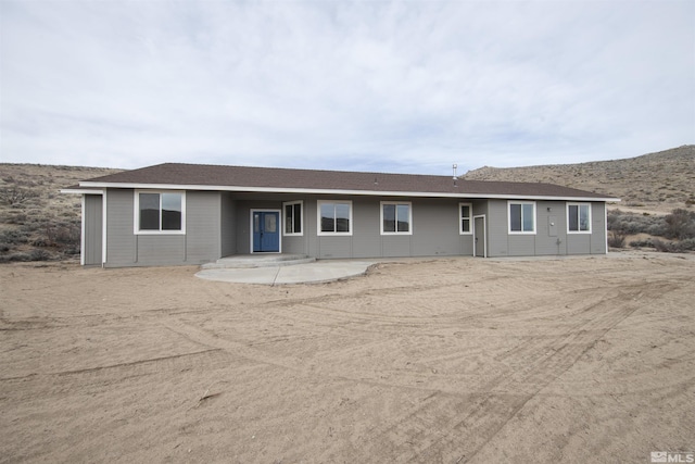 14485 N Red Rock Rd, Reno, NV 89508 - rear view of house with a mountain view