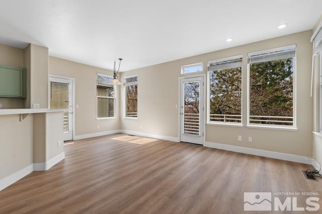 609 Caughlin, Reno, NV 89519 - unfurnished dining area featuring light wood-style flooring, baseboards, and recessed lighting