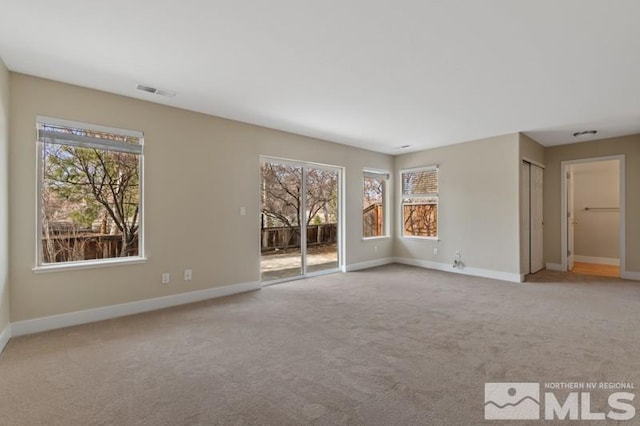 609 Caughlin, Reno, NV 89519 - unfurnished living room featuring carpet flooring, healthy amount of natural light, and baseboards