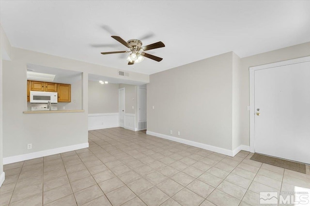 530 E Patriot Blvd, Reno, NV 89511 - unfurnished living room with a ceiling fan and baseboards