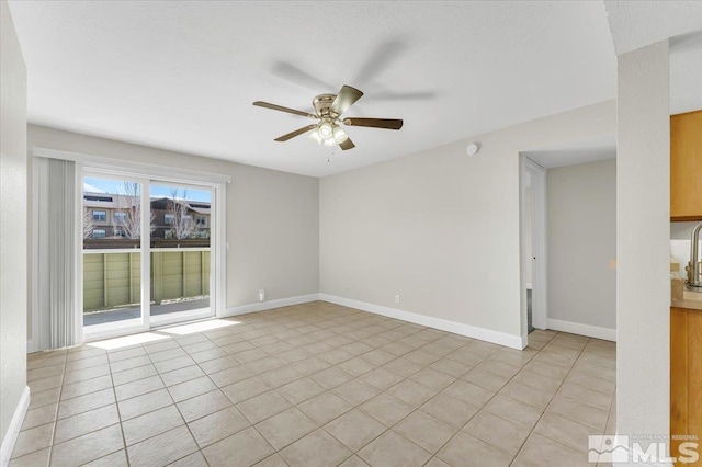 530 E Patriot Blvd, Reno, NV 89511 - empty room featuring ceiling fan, baseboards, and light tile patterned floors