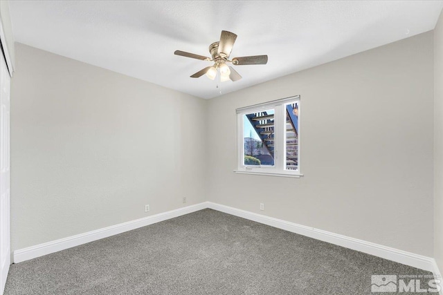 530 E Patriot Blvd, Reno, NV 89511 - empty room featuring dark carpet, baseboards, and ceiling fan