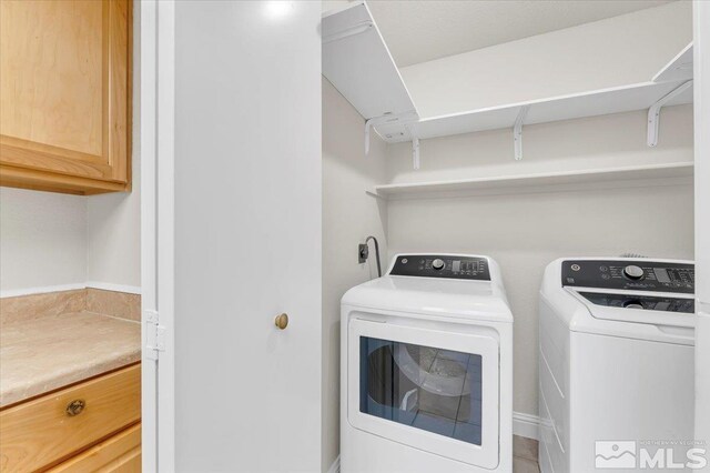 530 E Patriot Blvd, Reno, NV 89511 - washroom with cabinet space and washing machine and clothes dryer