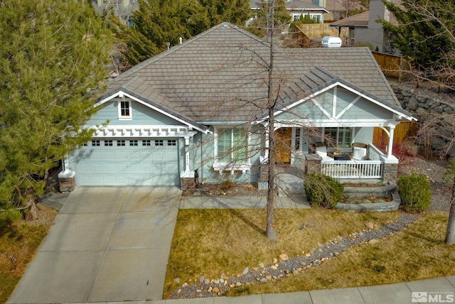 4940 Turning Leaf Way, Reno, NV 89519 - view of front of property with covered porch, concrete driveway, a garage, and a tiled roof