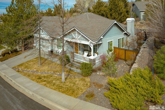 4940 Turning Leaf Way, Reno, NV 89519 - view of front of property with covered porch, a chimney, concrete driveway, stucco siding, and a tiled roof